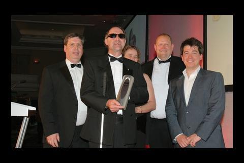 Ken Woodward of Mace (second left) receives the award for Health and Safety Champion